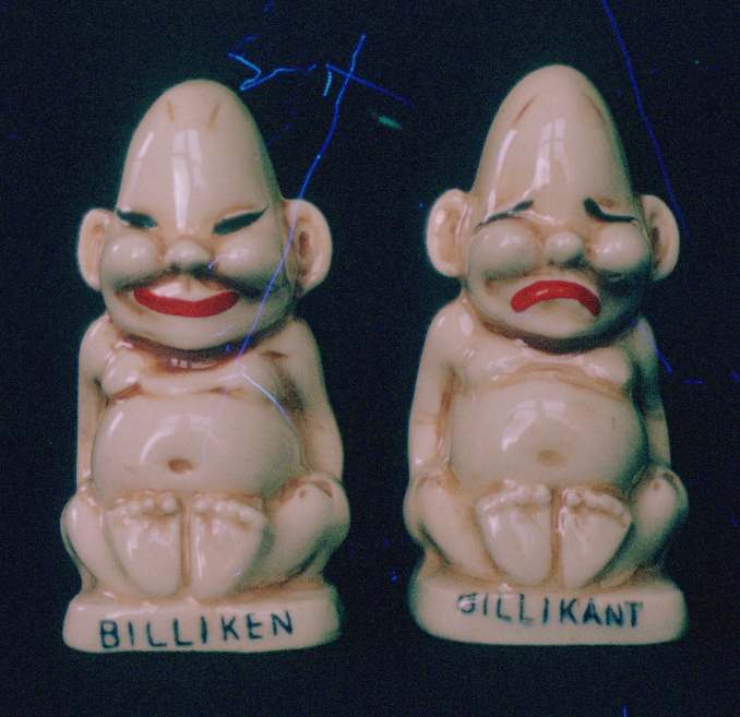 Salt and pepper shakers. Ceramic, three and a half inches high. Made in Japan.
