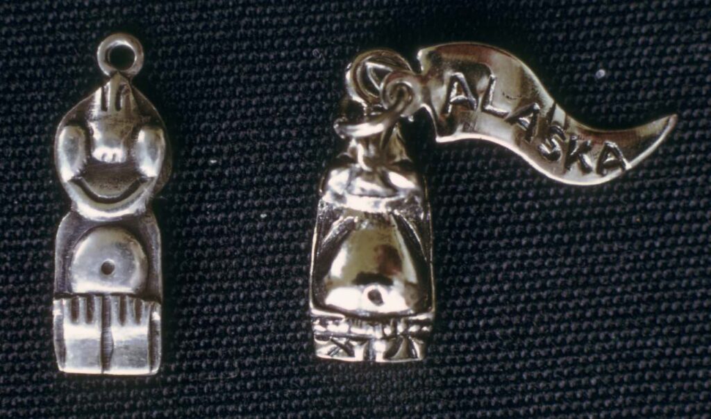 Sterling silver charm, 1973.