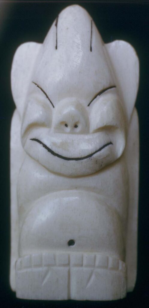 Billiken Figurine carved from whale jaw bone, three inches high. About 1960. Provenience unknown.