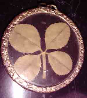 This image has an empty alt attribute; its file name is jewelry-clover-pendant.jpg